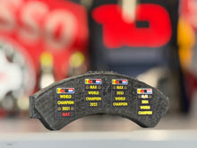 Load image into Gallery viewer, Grand Prix used Formula One Brake pad Red Bull Racing - Max Verstappen - FIA Formula One Drivers' World Champion F1-247